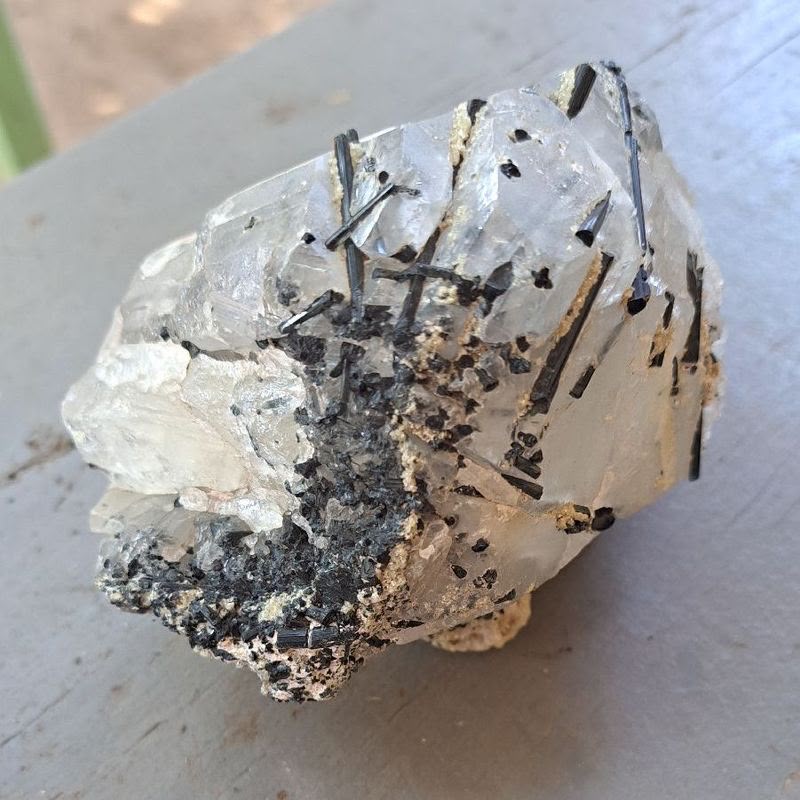 Raw white quartz crystal with black tourmaline needles